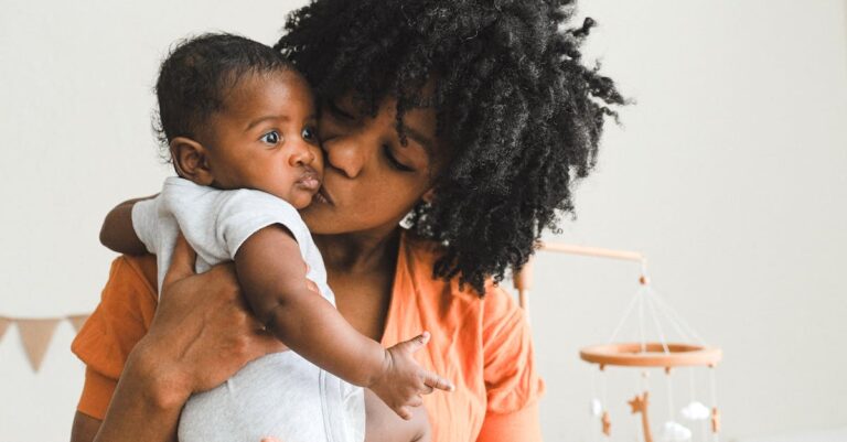 kissing newborn babies